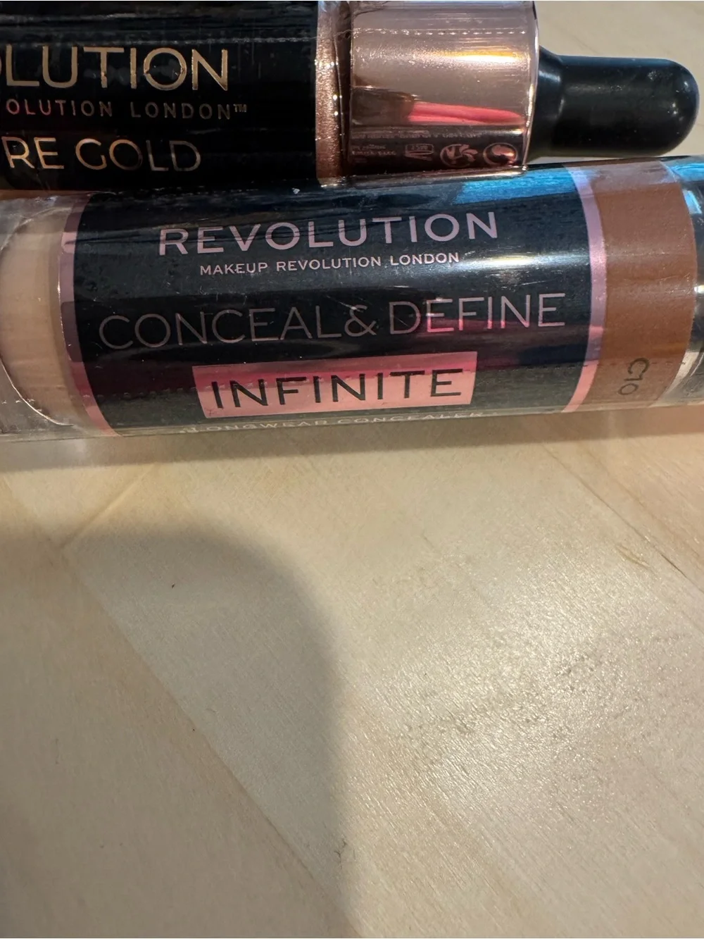 Revolution Concealer, Liquid Highlighters, and Baking Oil. All 4 included. NWT